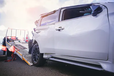 Roadside technician providing jump start assistance in New Orleans